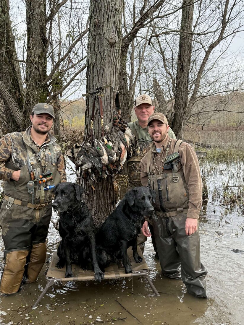 Payton duck hunting with his dog