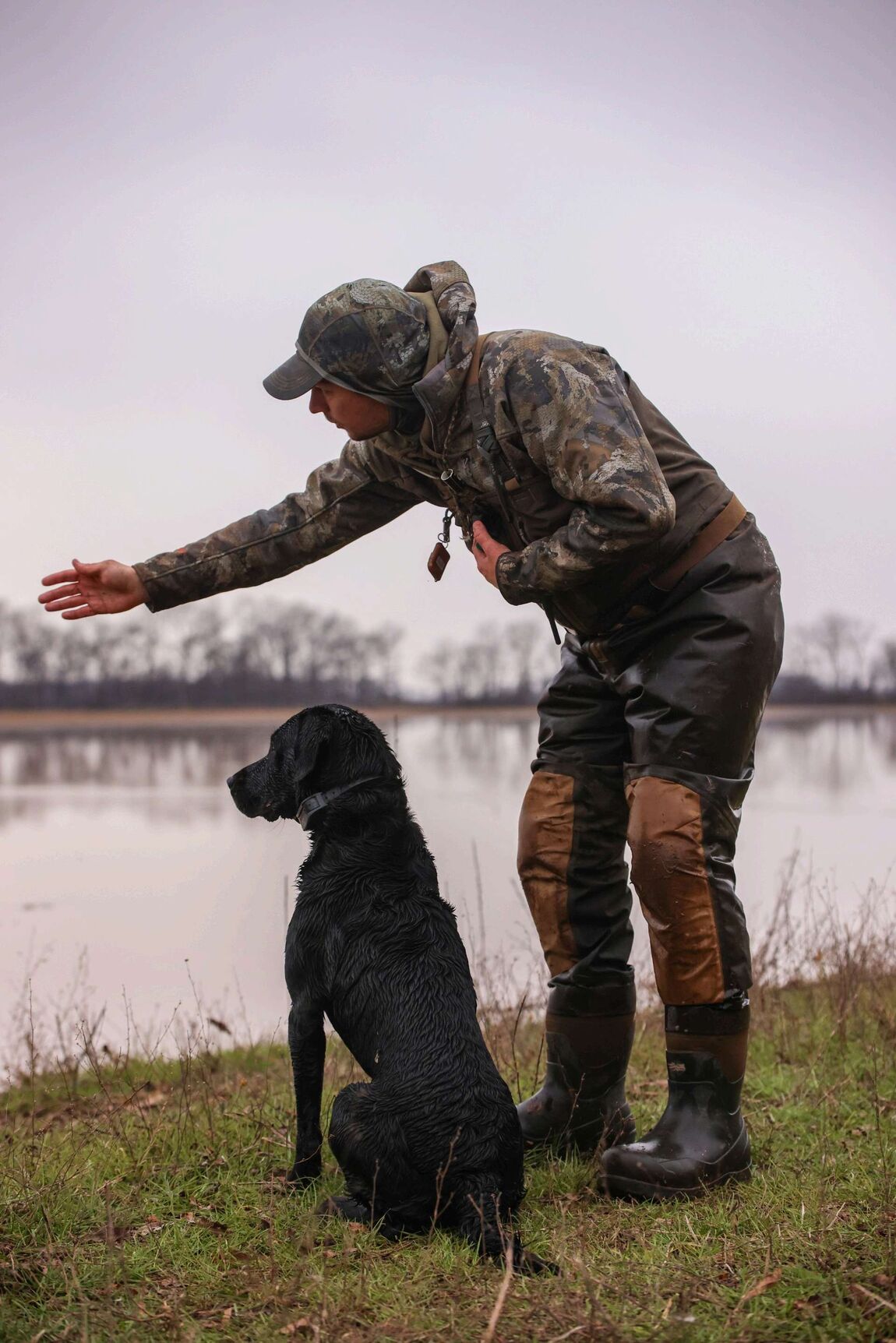 Payton Titus outdoors with his dog